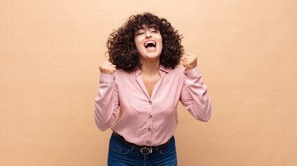  feeling shocked, excited and happy, laughing and celebrating success, saying wow!