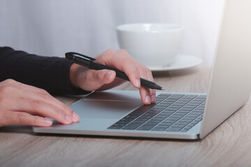 Cropped image of male hands working on computer. home isolation concept.