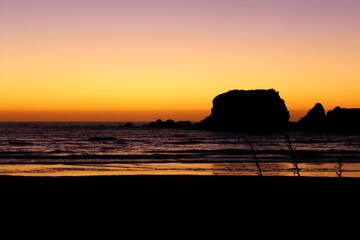 sunset on the beach and sea rock