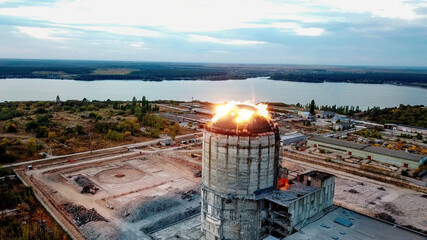 Demolition of old industrial building by exploding dynamite, aerial view