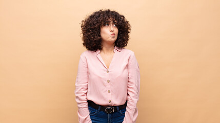  looking puzzled and confused, wondering or trying to solve a problem or thinking