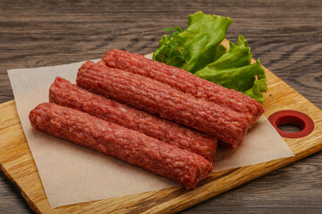 Raw beef sausages with spices