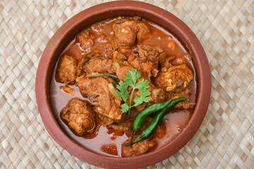 Top view Kolhapuri chicken curry roast or Vindaloo hot and spicy gravy dish Mumbai, India. North...