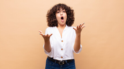  feeling extremely shocked and surprised, anxious and panicking, with a stressed and horrified look