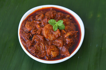 Chilli chicken curry, chicken manchurian  Mumbai, Delhi India dark background. Top view of popular North Indian meat side dish for Chapati, Roti, Naan, Paratha, fried rice, Indo Chinese cuisine.