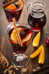 Mulled wine hot drink with citrus, apple and spices