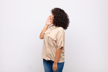  profile view, looking happy and excited, shouting and calling to copy space on the side