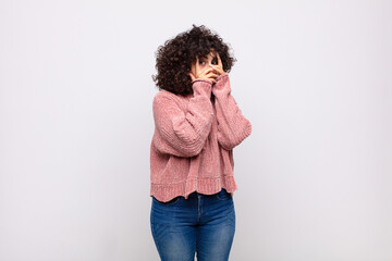  feeling scared or embarrassed, peeking or spying with eyes half-covered with hands