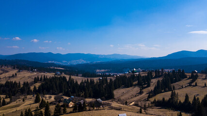 Obraz premium Alpine village settlement of a house on top of a mountain aerial photo Carpathians Ukraine.