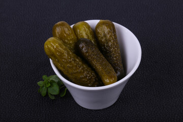 Pickled cucumbers heap in the bowl