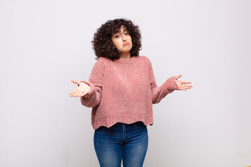  feeling puzzled and confused, unsure about the correct answer or decision, trying to make a choice