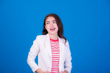 Portrait of beautiful asia young woman, on blue color background with copy space. Human face...