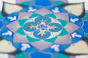 Unfinished decorative plate or platter, painted with blue, violet, grey and green acrylic paint
