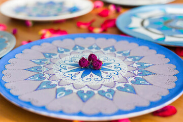 Decorative plate or platter, painted in oriental style with blue, violet and silver acrylic paint