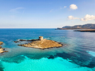 Stintino, turquoise sea water, coastline and tower. Sardinia, Italy