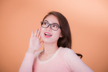 Portrait of beautiful asia young woman, on yellow color background with copy space. Human face expressions, emotions feelings, body language,beauty and fashion concept.