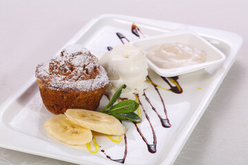 Tasty hot muffin with ice cream