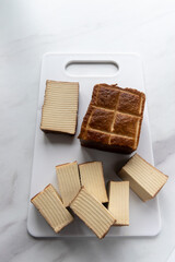 smoked tofu on a white chopping board 