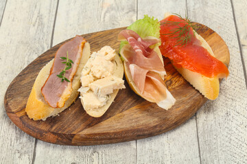 Tapas - bruschetta with prosciutto, salmon, duck and gorgonzola