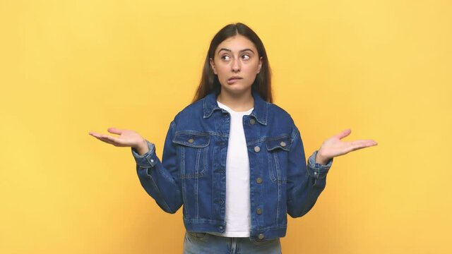 Young caucasian woman confused and doubtful shrugging shoulders to hold a copy space