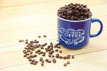 natural coffee beans in a blue mug