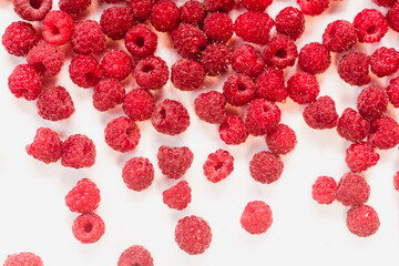 Dripping raspberry on white background.
