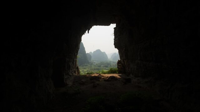 Mountain cave view lookout over karst mountain landscape cloud shadow time lapse