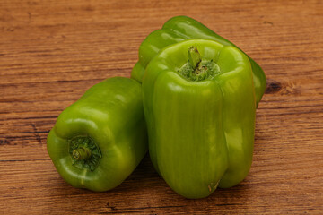 Three green bell juicy peppers