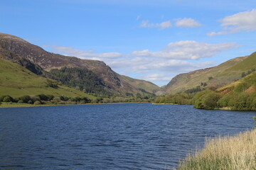 A sunny view of Llyn Mwyngil and Snowdonia near Cadair Idris in Gwynedd, Wales.