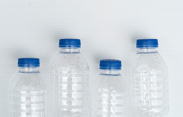 Pure plastic water bottles isolated on white background