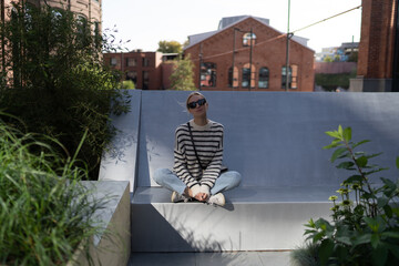 Beautiful girl posing in the street. Urban style.