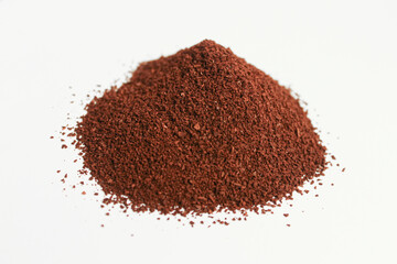 Coffee powder on white surface.
