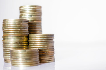 gold coin stack row growing pile on white background for money saving and investment business financial and banking concept.
