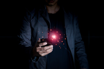 Businessman hand using smartphone in dark tone for high speed internet and technology communication concept