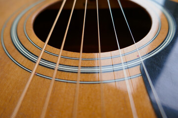 Acoustic guitar, guitar strings background.