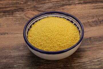 Raw cous cous heap in the bowl