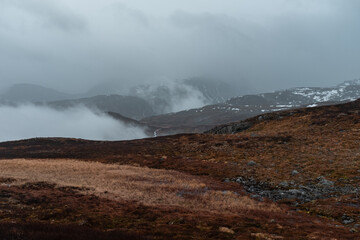 Mountainous Terrain Landscape with Misty Clouds
