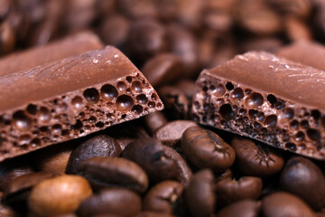 Close-up of dark roasted coffee beans and chocolate background. Aromatic coffee grains and sweet choco pieces macro photography. - Powered by Adobe