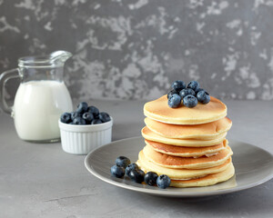 homemade pancakes with fresh blueberries and delicious milk