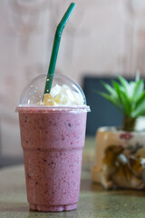 Blueberry smoothie yoghurt with whipped cream