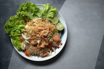 Thai spicy seafood salad with vermicelli and minced pork.