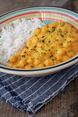 chickpeas with curry accompanied by basmati rice