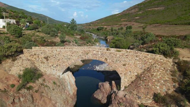 Aerial view of the Ponte Vecchiu bridge over the Fango river in the Balagne region of Corsica