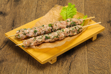 Raw minced pork skewer kebab for grill