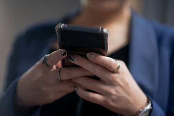 woman hands play on her mobile