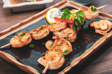 Tasty grilled shrimps with spices served on a plate