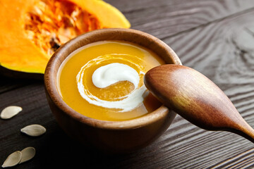 Vegetarian autumn pumpkin soup with sour cream