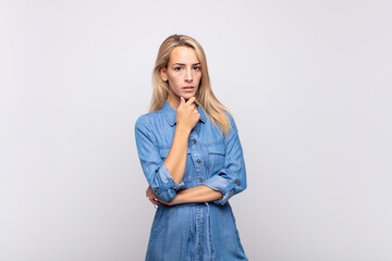  looking serious, confused, uncertain and thoughtful, doubting among options or choices