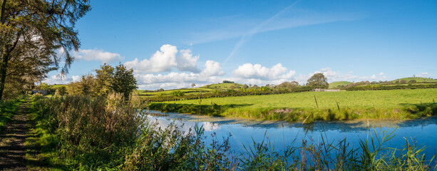 Panaorama of English rural countryside scenery on British waterway canal