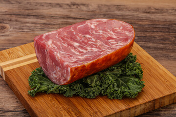 Beef ham piece over board